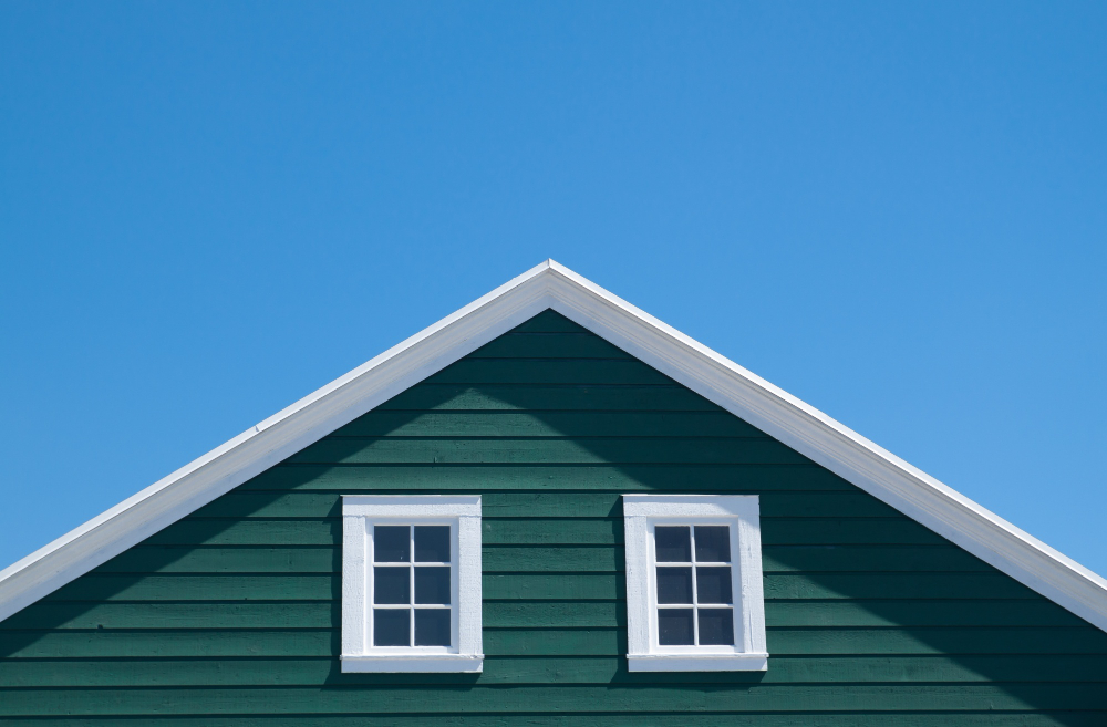 green-house-white-roof-with-blue-sky-sunny-day